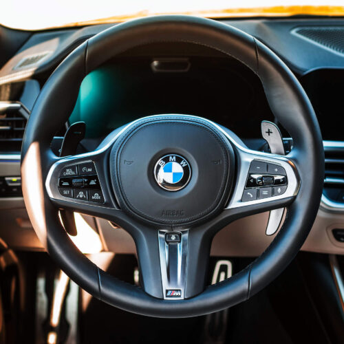 Aluminium matte black paddle shifters installed in a BMW G21