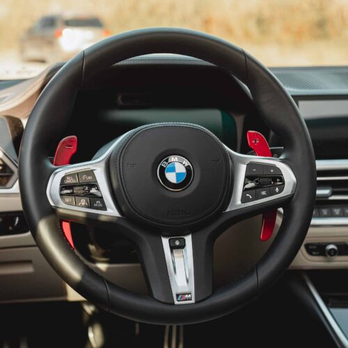 Aluminium gloss red paddle shifters installed in a BMW G20