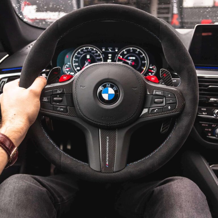 paddleshifterz carbon fiber paddle shifters in a BMW F90 M5 with alcantara steering wheel
