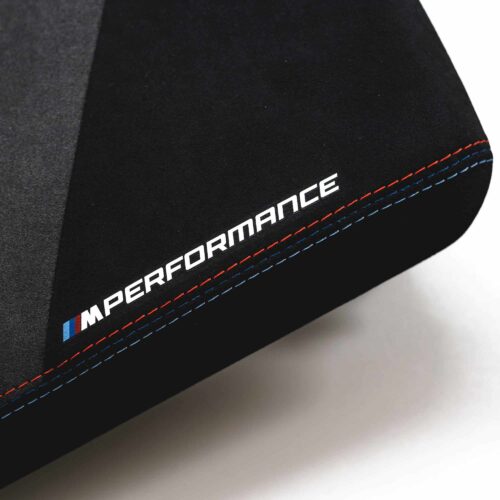 Original BMW M Performance Armrest Alcantara 51165A5D595 close up shot of M Performance logo