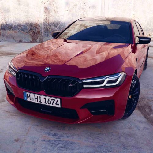 PaddleShifterz OEM BMW F90 M5 Competition LCI Front Grille Set - 51138082107, 51138082108 showing a red BMW F90 M5 LCI from the front