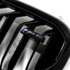 Close up view of the M5 logo on OEM BMW M Perf F90 LCI Carbon front grille – 51712469540