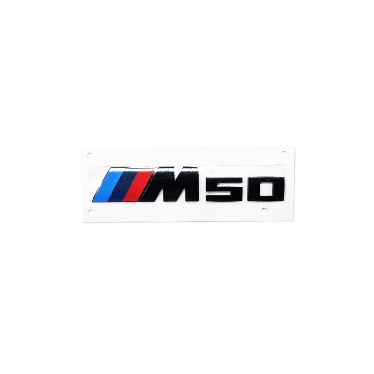 PaddleShifterz Original BMW M50 black badge for BMW G26 i4 models, photographed from a top view showing the M50 logo in black