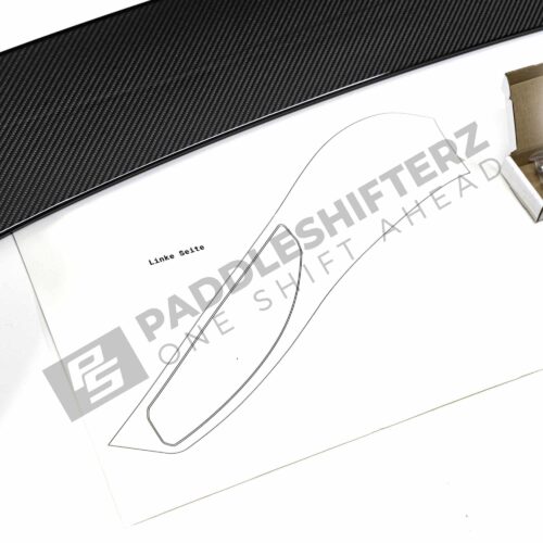 Close up view of the template of OEM BMW M Perf G87 gloss carbon fiber wing – 516625B33F50