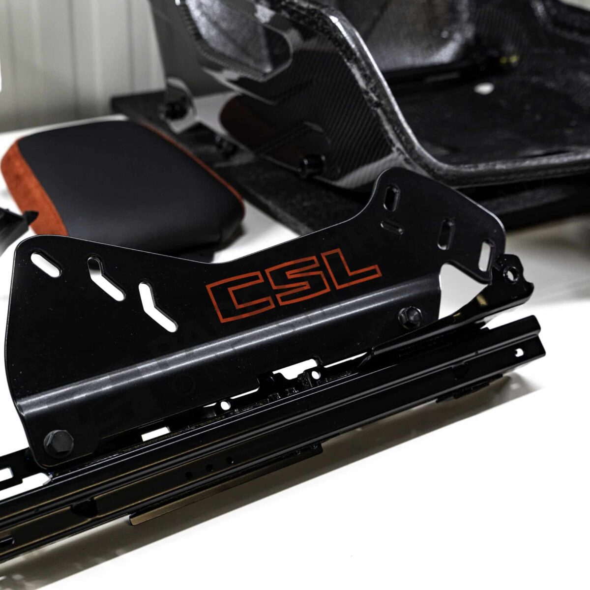 Close up shot of the seat mechanism of the OEM BMW G82 M4 CSL Complete Left Carbon fiber bucket seat