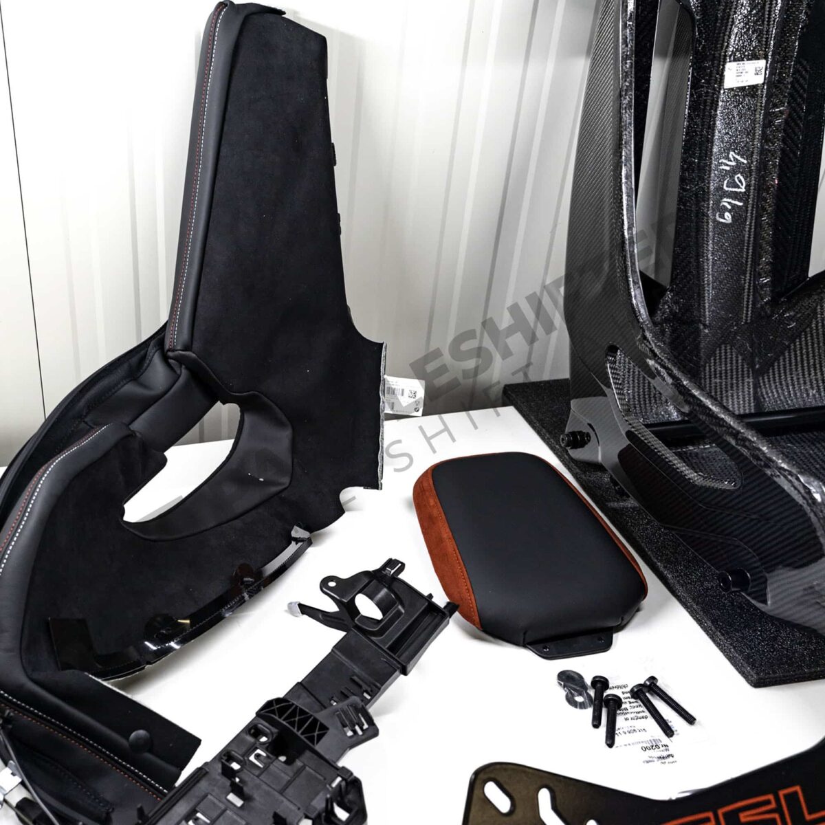 Shot of the accessories for the OEM BMW G82 M4 CSL Complete Left Carbon fiber bucket seat
