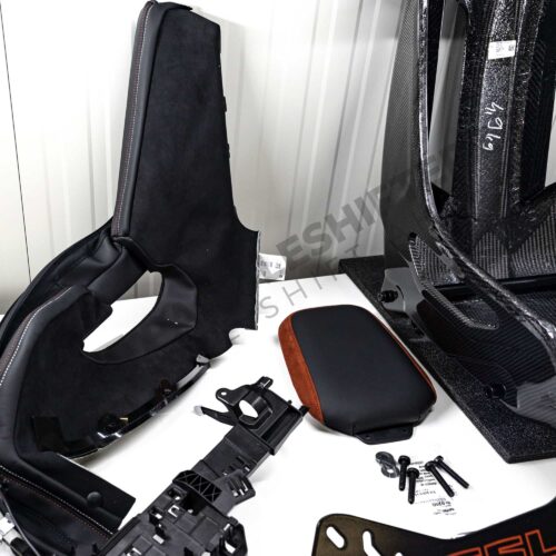 Shot of the accessories for the OEM BMW G82 M4 CSL Complete Left Carbon fiber bucket seat