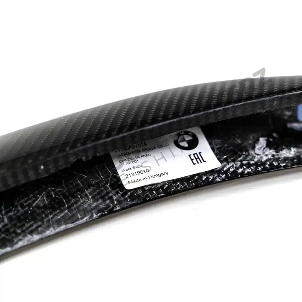 Rear, close up view of the OEM BMW M Performance Carbon fiber trunk spoiler - 51195A57B14 for the BMW G20 LCI