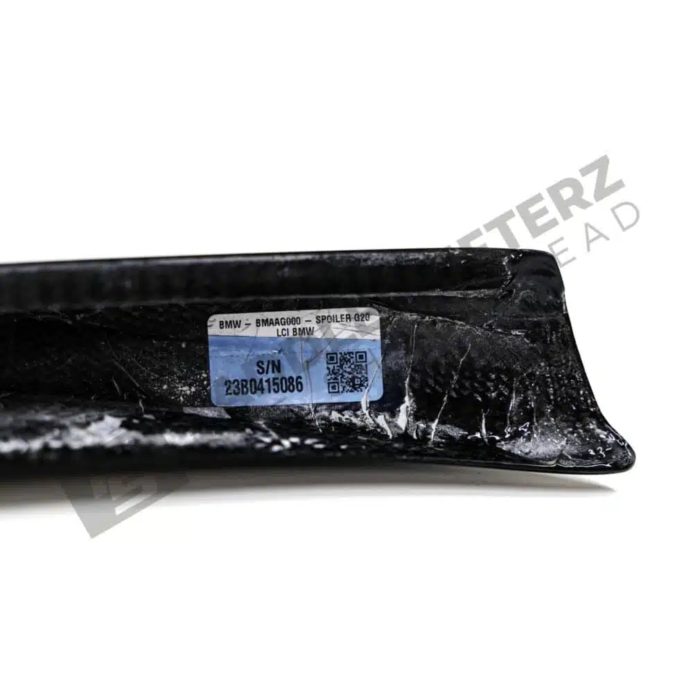 Rear view of the OEM BMW M Performance Carbon fiber trunk spoiler - 51195A57B14 for the BMW G20 LCI showing the labels