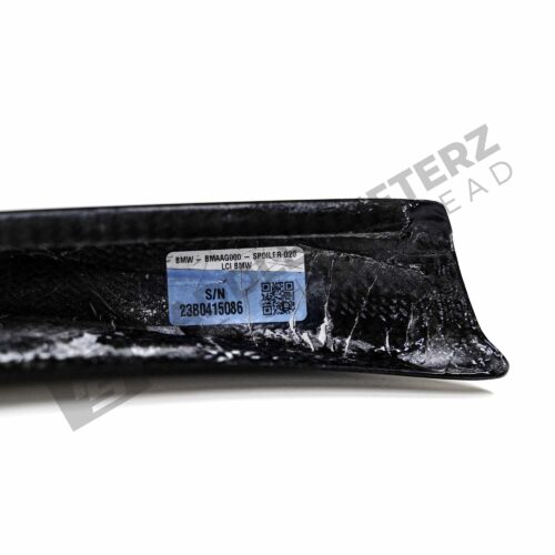 Rear view of the OEM BMW M Performance Carbon fiber trunk spoiler - 51195A57B14 for the BMW G20 LCI showing the labels