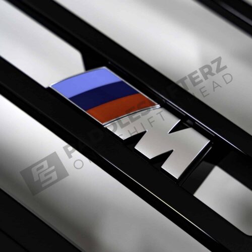 Close up of the M logo on OEM BMW G22, G23 Shadowline Front Grille LCI - 51135A55DA8