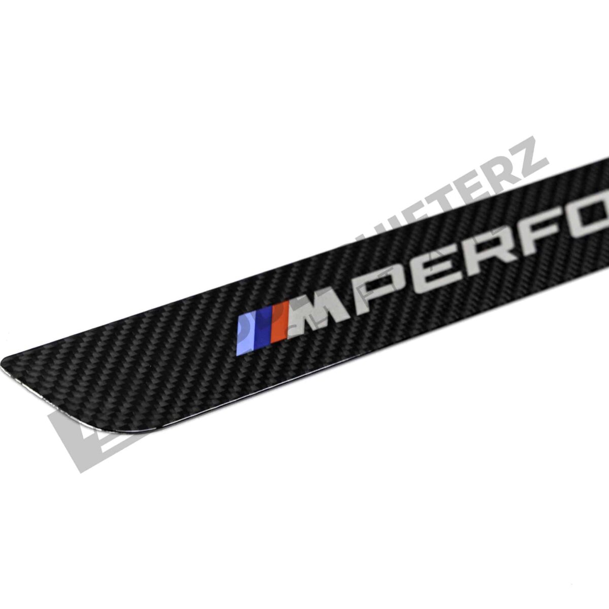 Close up of OEM BMW M Performance Carbon door sill trim - 51475A6CBC3