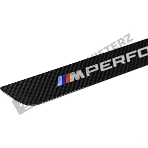 Close up of OEM BMW M Performance Carbon door sill trim - 51475A6CBC3