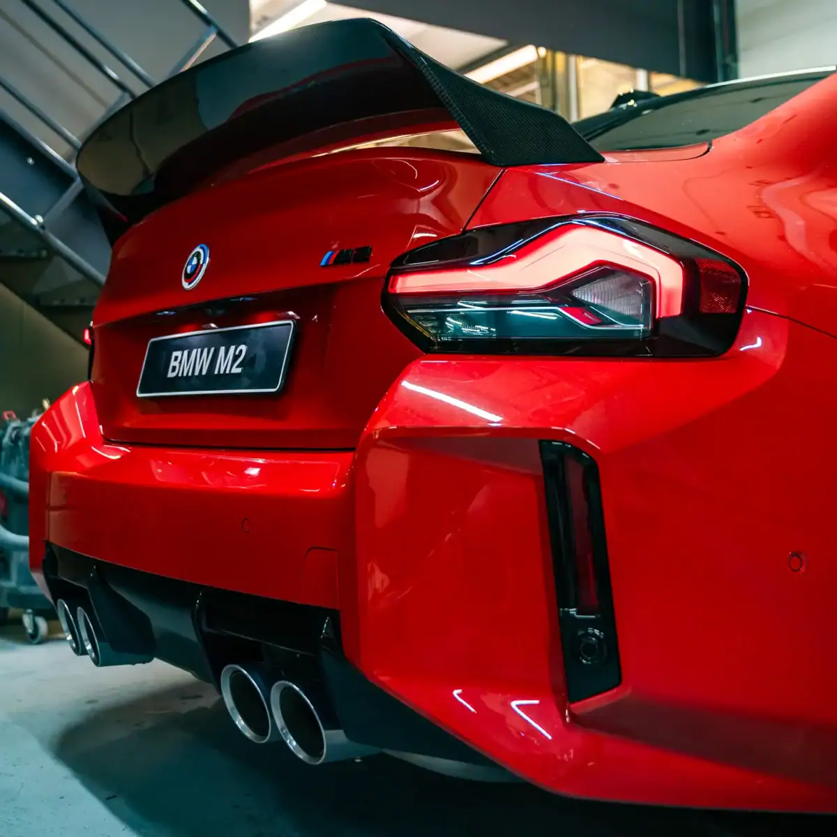 PaddleShifterz BMW G87 M2 in toronto red with chrome tailpipes