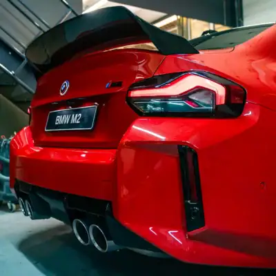 PaddleShifterz BMW G87 M2 in toronto red with chrome tailpipes