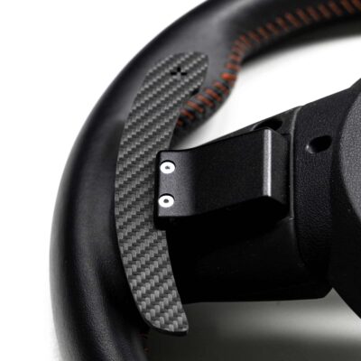 Structured carbon fiber paddle shifters for MINI F Series on a wheel from the rear