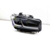 Front view of the OEM BMW F90 M5 CS laser headlight, for right hand drive vehicles, right side, shown on a white background 63118086468