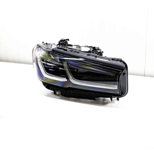 Front view of the OEM BMW F90 M5 CS laser headlight, for right hand drive vehicles, right side, shown on a white background 63118086468