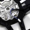 Close up shot of the OEM BMW M4 Flat bottom alcantara steering wheel, 32307908500 showing the white heating cable