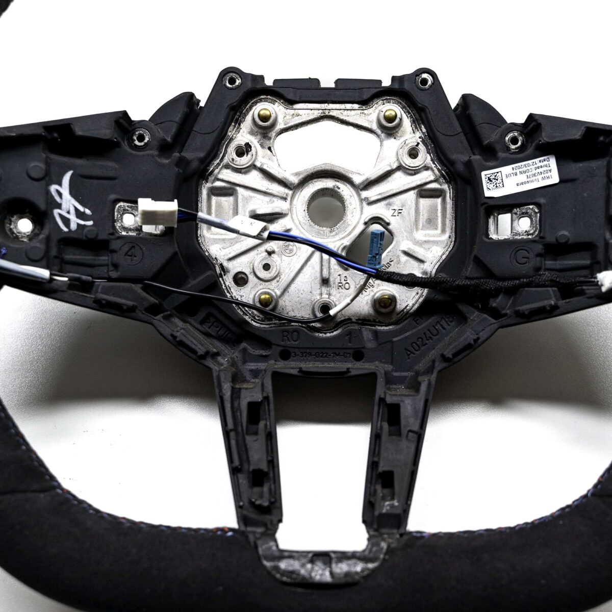 Close up shot of the OEM BMW M Flat bottom alcantara steering wheel - 32307908502