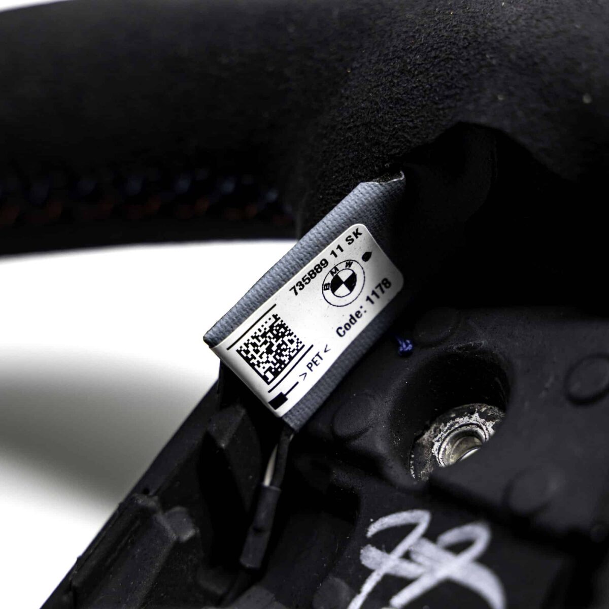 Close up of the label of the OEM BMW M Flat bottom alcantara steering wheel - 32307908502