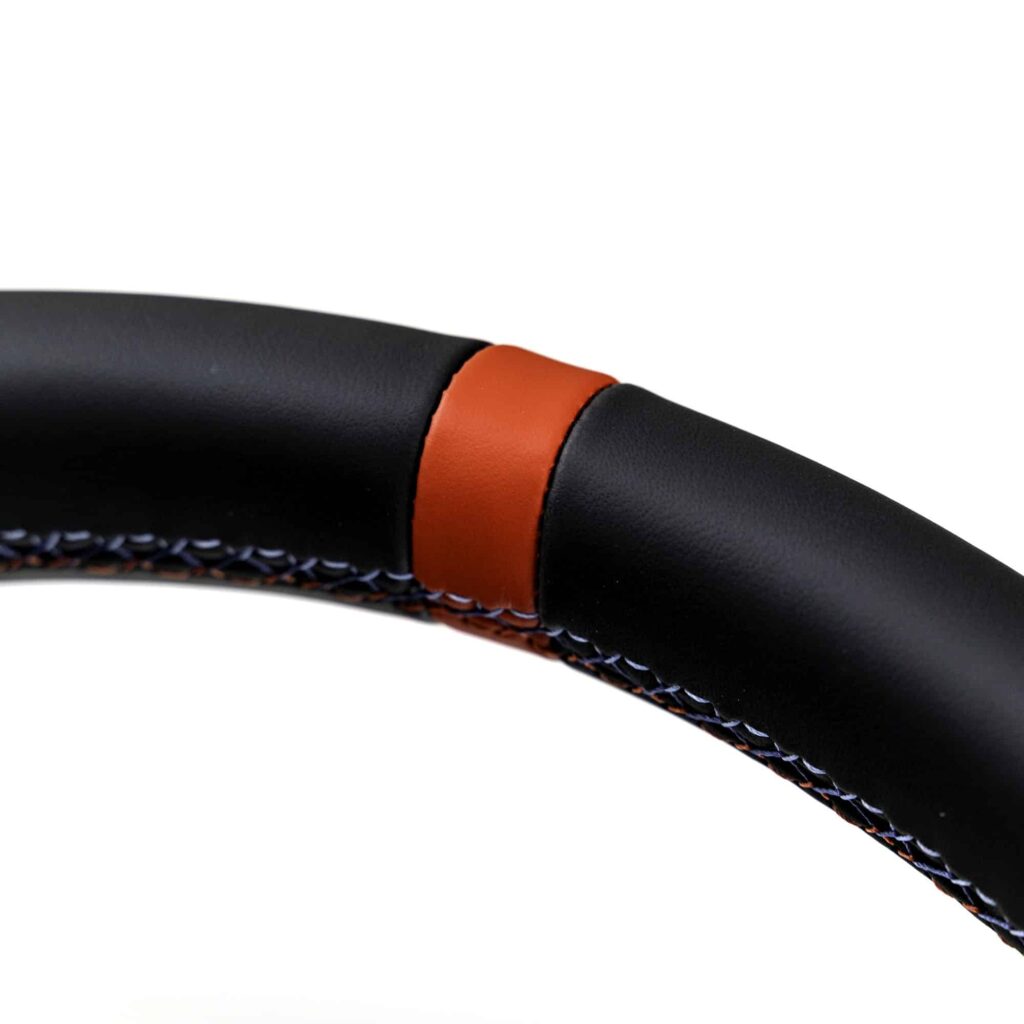 Close up shot of the striping of the OEM BMW M4 Flat bottom leather steering wheel, 32305A8A906