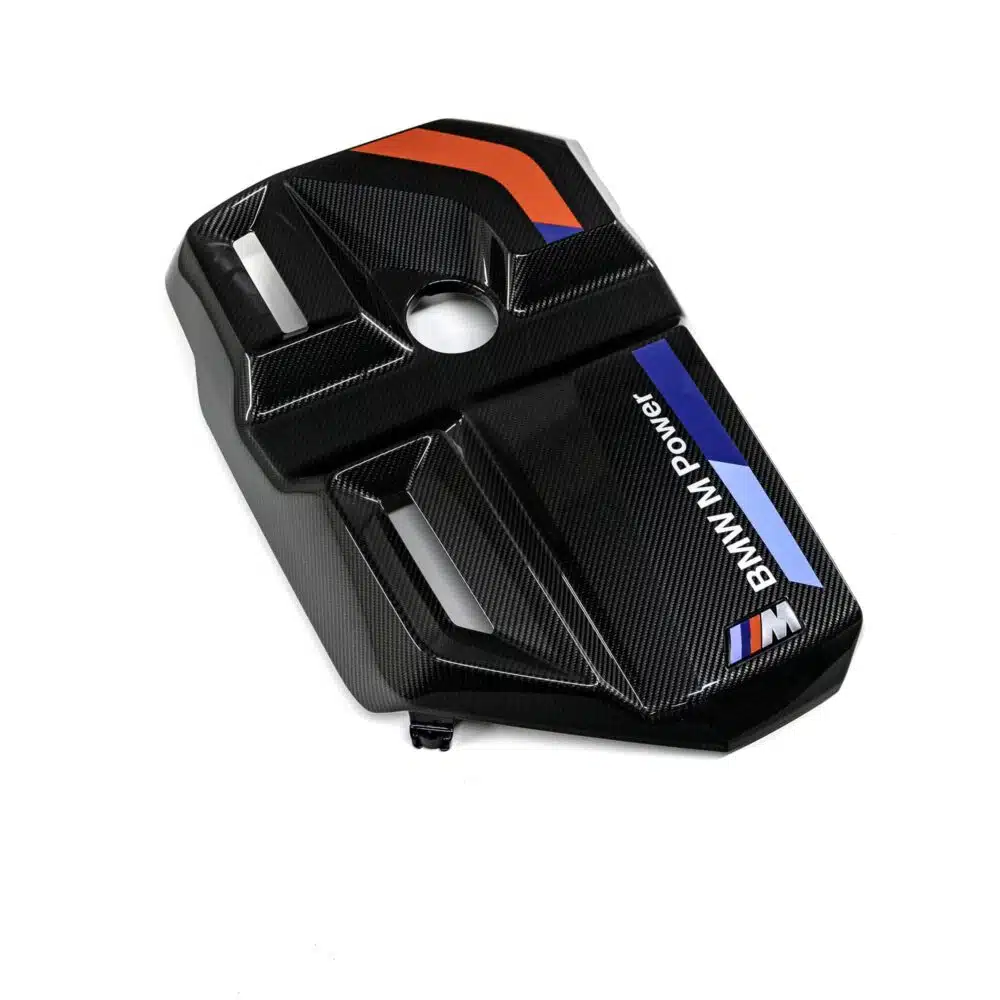 OEM BMW Carbon fiber engine cover for the G87 M2, G80, G81, G82, G83 BMWs photographed from the top