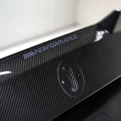 close up shot of the emblem of OEM BMW M Performance Carbon fiber trunk lid - 41622460278