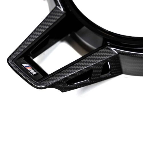 Close up shot of the M logo on the OEM BMW M Sport steering wheel trim with driving assistant professional M4 LCI - 32307908506