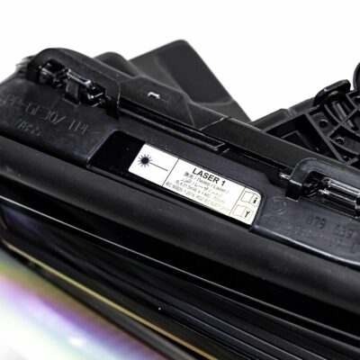 Close up of an OEM BMW F90 M5 CS laser headlight, for right hand drive vehicles, left side with label