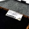 Close up view of the OEM BMW Carbon Seat Bottom Cover Kyalami Orange 52109882584