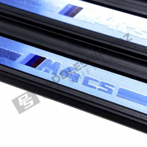 A close up shot of the OEM BMW G82 M4 CS Door sill trim - 51478086134 with the M4 CS logo