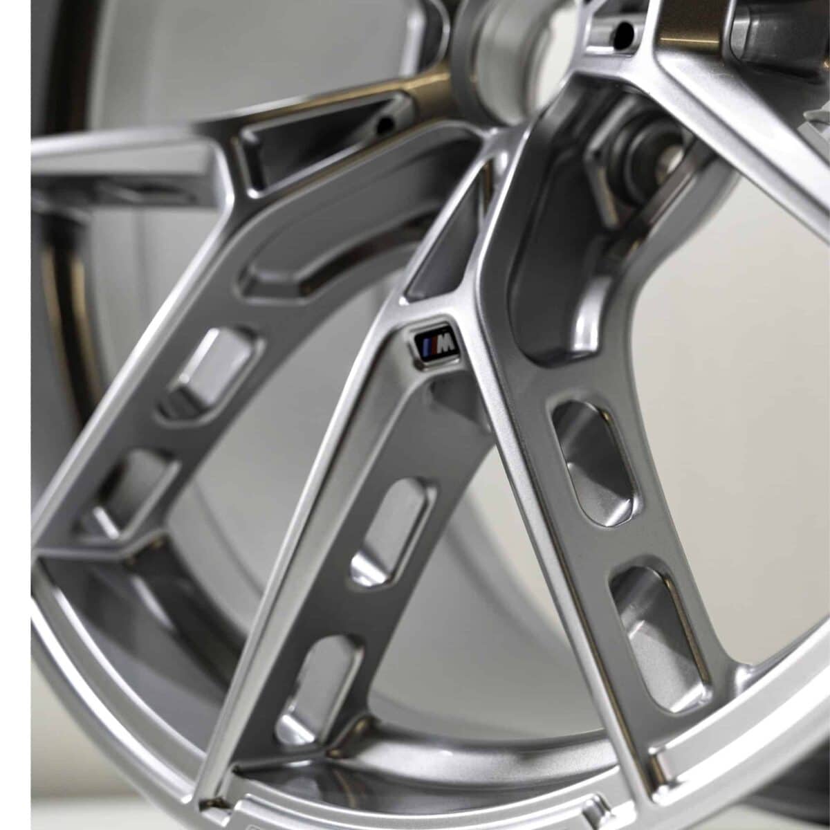 Close up shot of the OEM BMW M Performance 1063M Rear wheel in size 10,5Jx21ET20 part number 36108089392 showing the holes in the rim