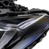 Close up shot of the BMW G82 M4 CS LCI Left LED headlight from the side showing the Laser logo 63115B36FA3