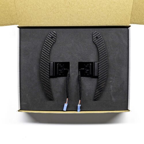 PaddleShifterz Magnetic gloss carbon fiber paddle shifters for BMW F series photographed in a white box with black foam insert