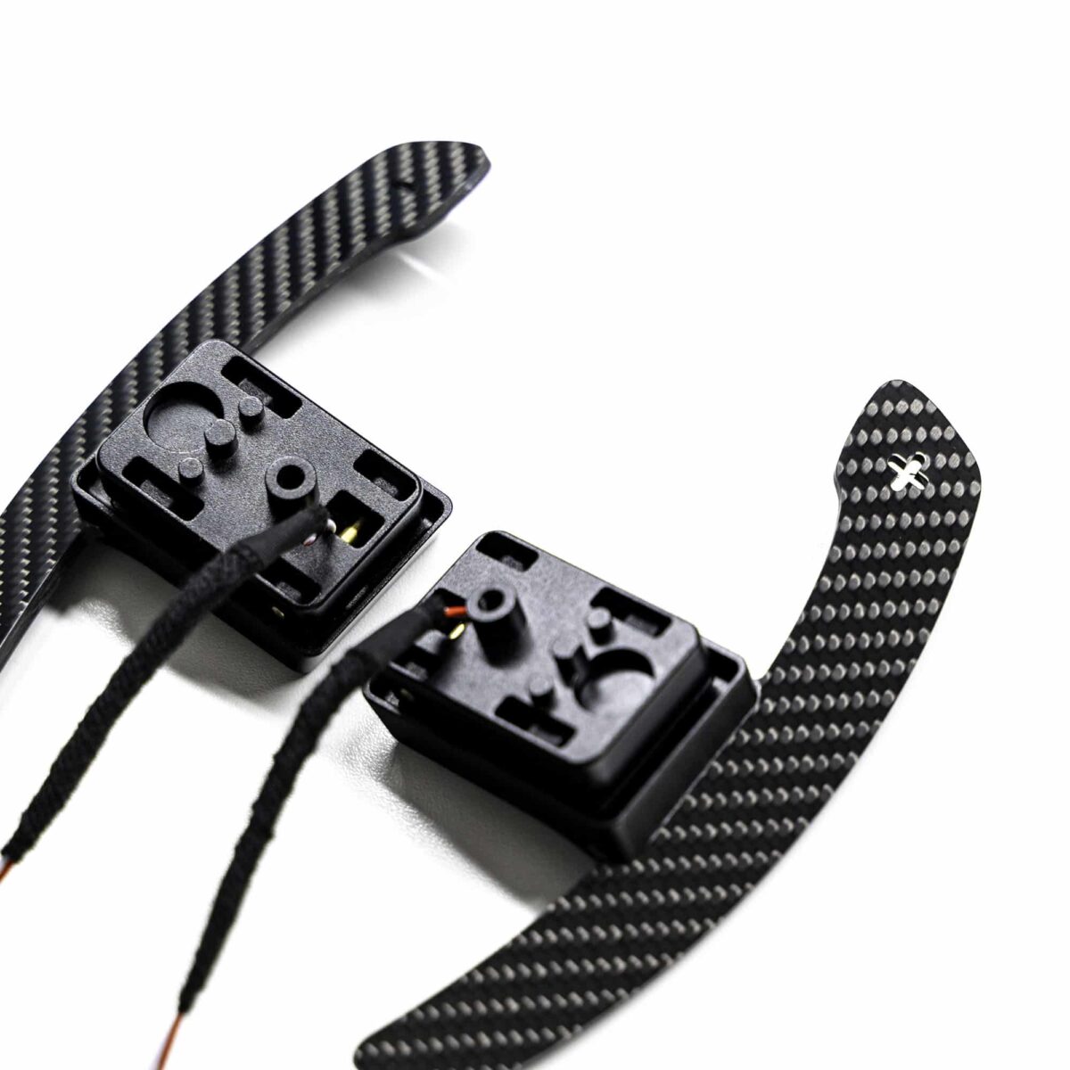 Close up shot of the magnetic gloss carbon fiber paddle shifters designed for MINI F series