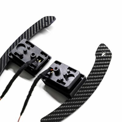 Close up shot of the magnetic gloss carbon fiber paddle shifters designed for MINI F series
