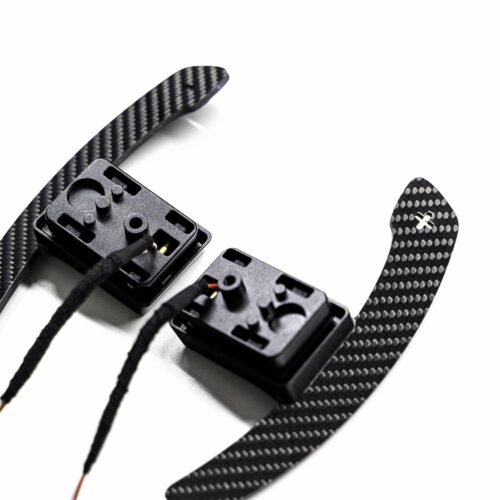 Close up shot of the magnetic gloss carbon fiber paddle shifters designed for MINI F series