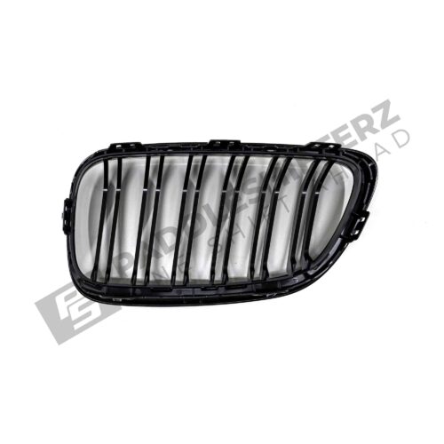 OEM BMW gloss black front grille for F87 M2 51712355447left side photographed top down from the back
