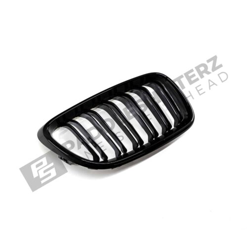OEM BMW gloss black front grille for F87 M2 51712355447left side photographed from side