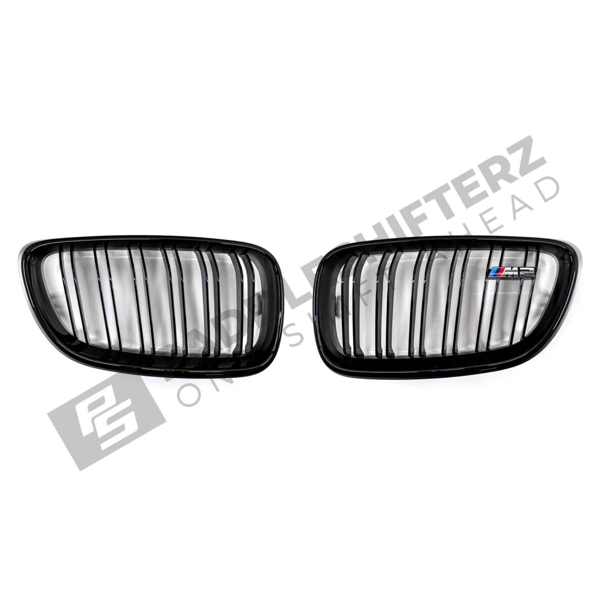 Eine Aufnahme des PaddleShifterz OEM BMW Gloss Black Kühlergrills BMW F87 M2 51712355447 51712355448 von oben auf einem weißen Hintergrund