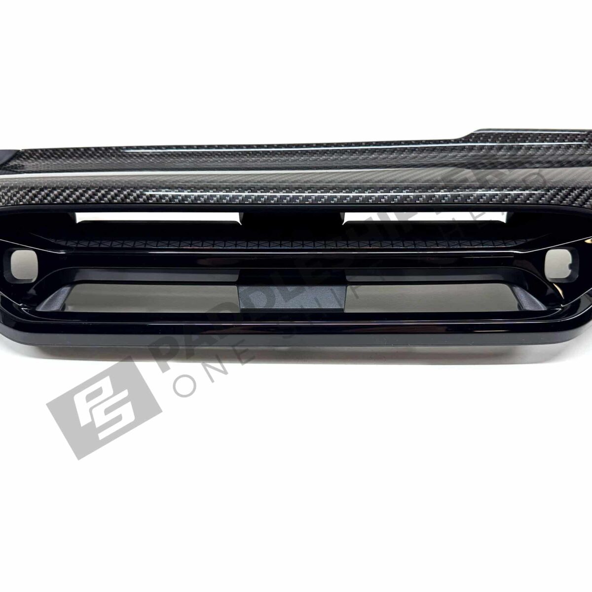 Close up shot of the OEM BMW LCI Carbon fiber dashboard trim LHD – 51459633604, showing the center