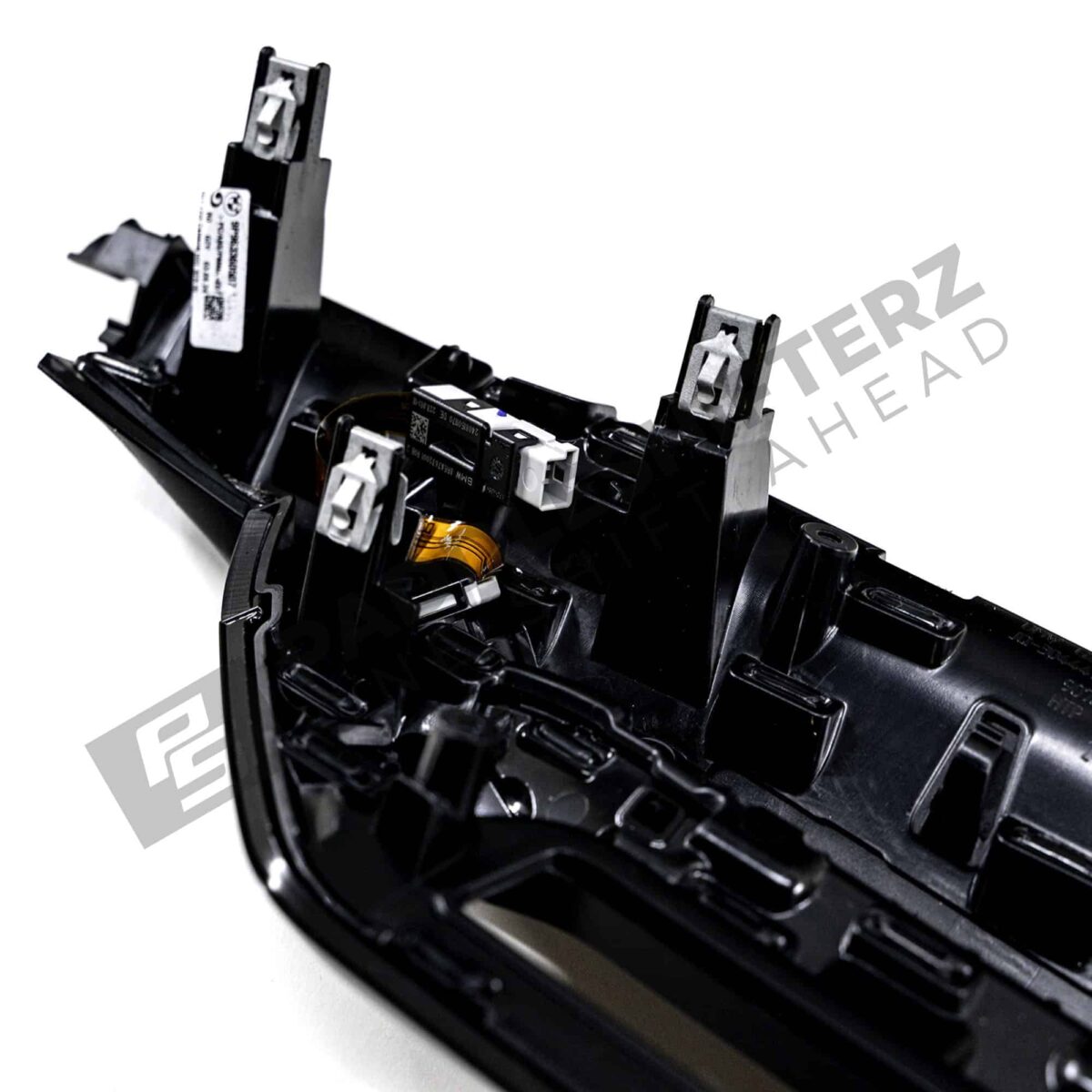 Close up shot of the clips on the OEM BMW LCI Carbon fiber dashboard trim RHD - 51459633605