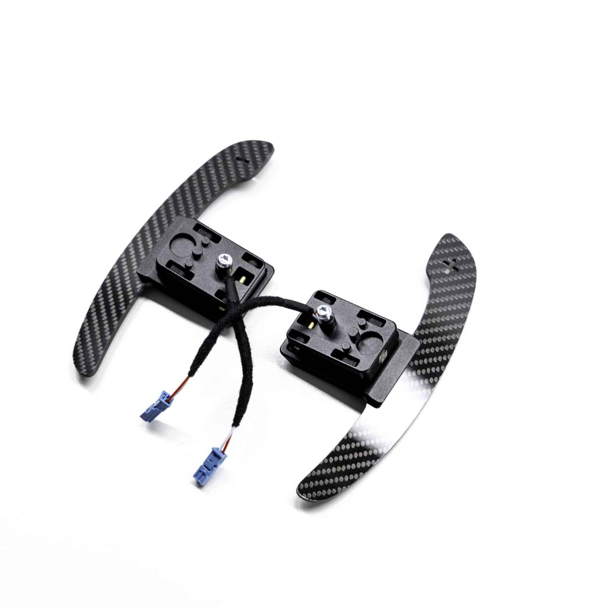 Gloss carbon fiber paddle shifters with magnetic component on a white background