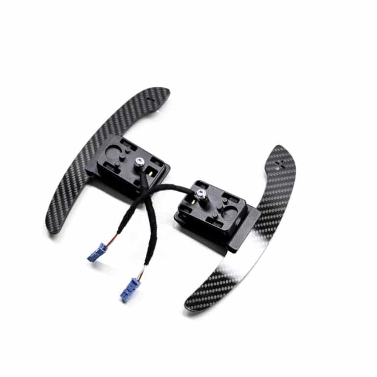 Gloss carbon fiber paddle shifters with magnetic component on a white background