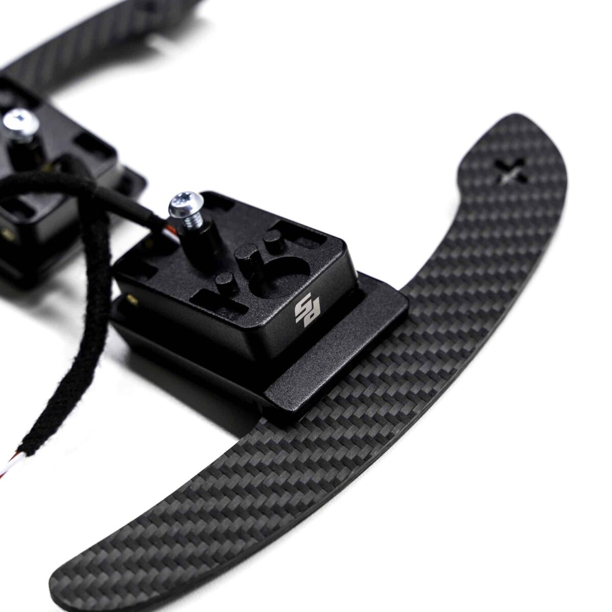 Magnetic paddle shifters, structured carbon BMW G close up