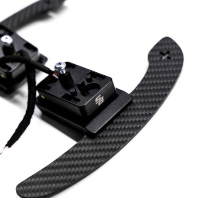Magnetic paddle shifters, structured carbon BMW G close up
