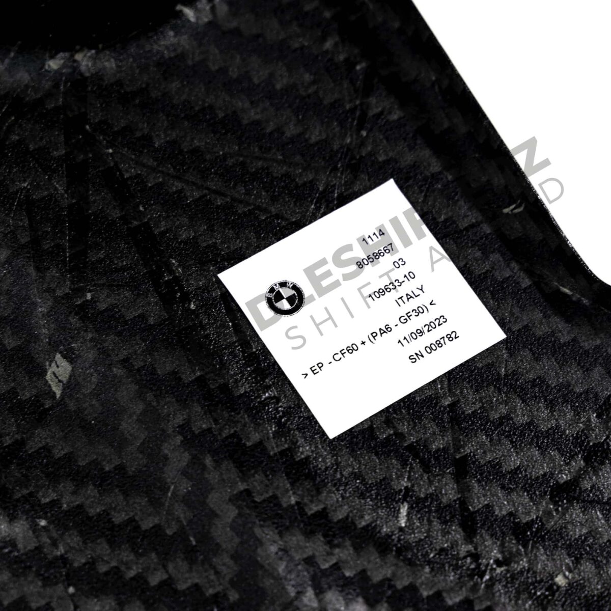 View of the labels on the OEM BMW M Performance carbon engine cover - 11148058667
