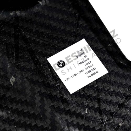 View of the labels on the OEM BMW M Performance carbon engine cover - 11148058667
