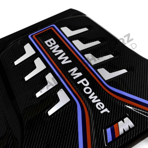 Close up view of the BMW M Power logo on the OEM BMW M Performance carbon engine cover - 11148058667